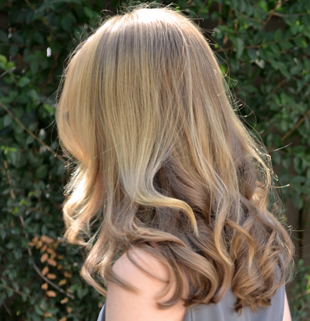 Curling iron clearance that holds curl