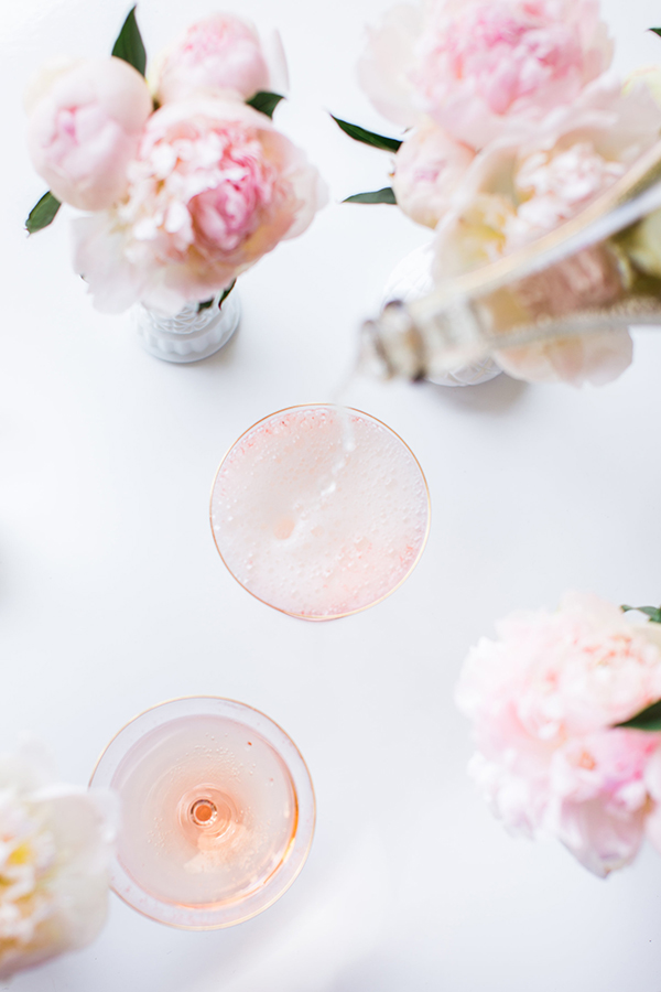 Pouring champagne over these Cotton Candy cocktails.