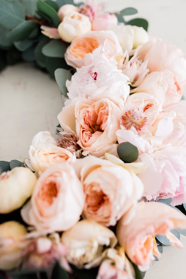 A holiday wreath made with fresh peonies.