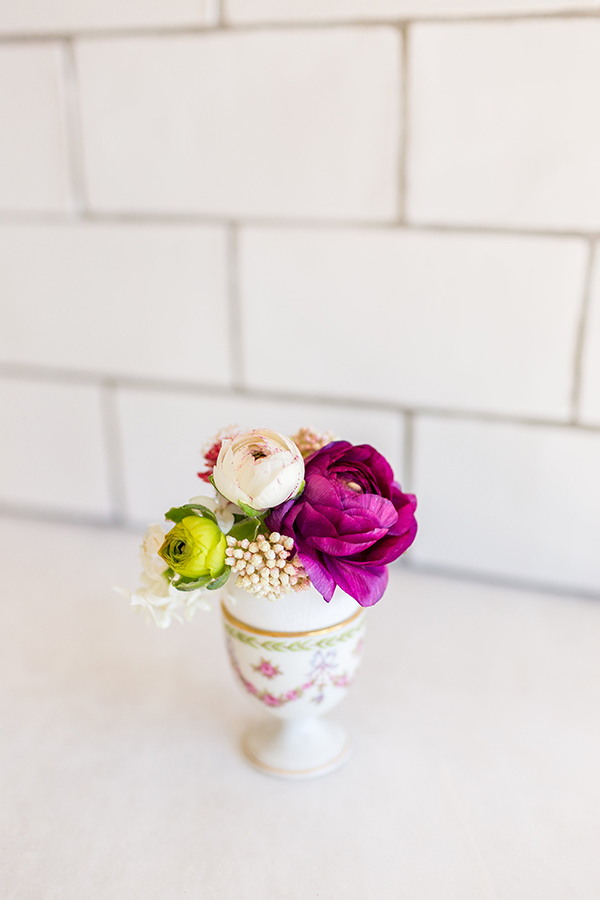 Mini flower arrangements in eggshell vases