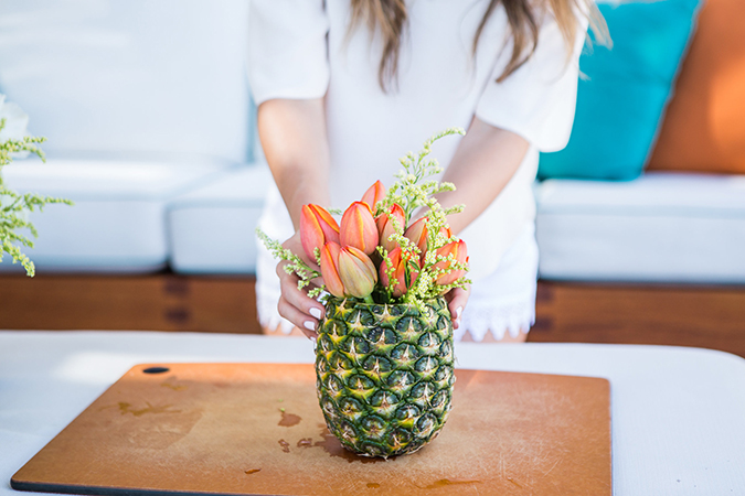 See this pretty how-to on flowery fruit vases