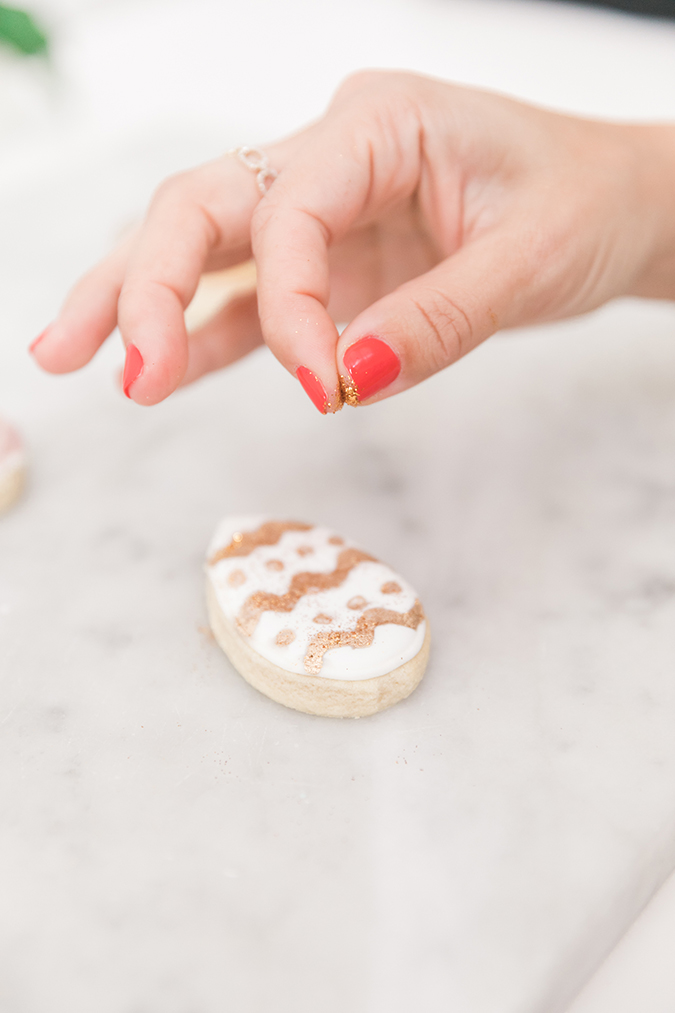 Painted easter egg cookies with metallic luster dust