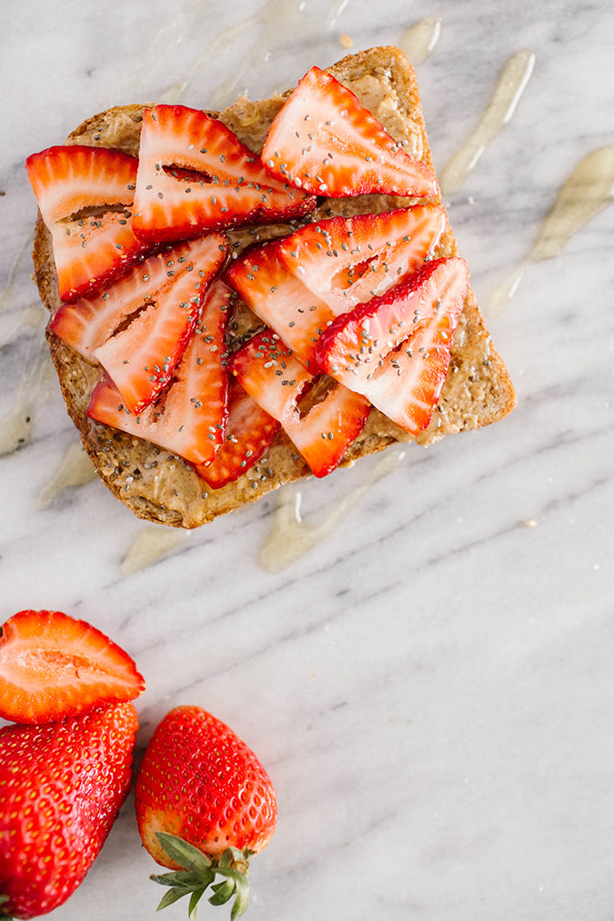 almond butter, honey, and strawberry breakfast toast