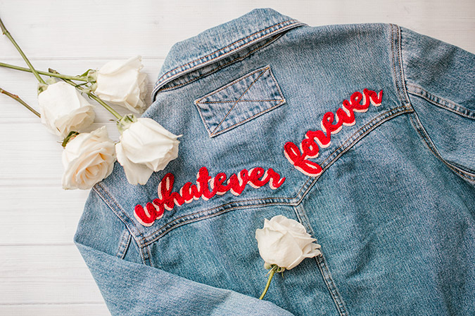 Denim jackets with writing on hot sale the back